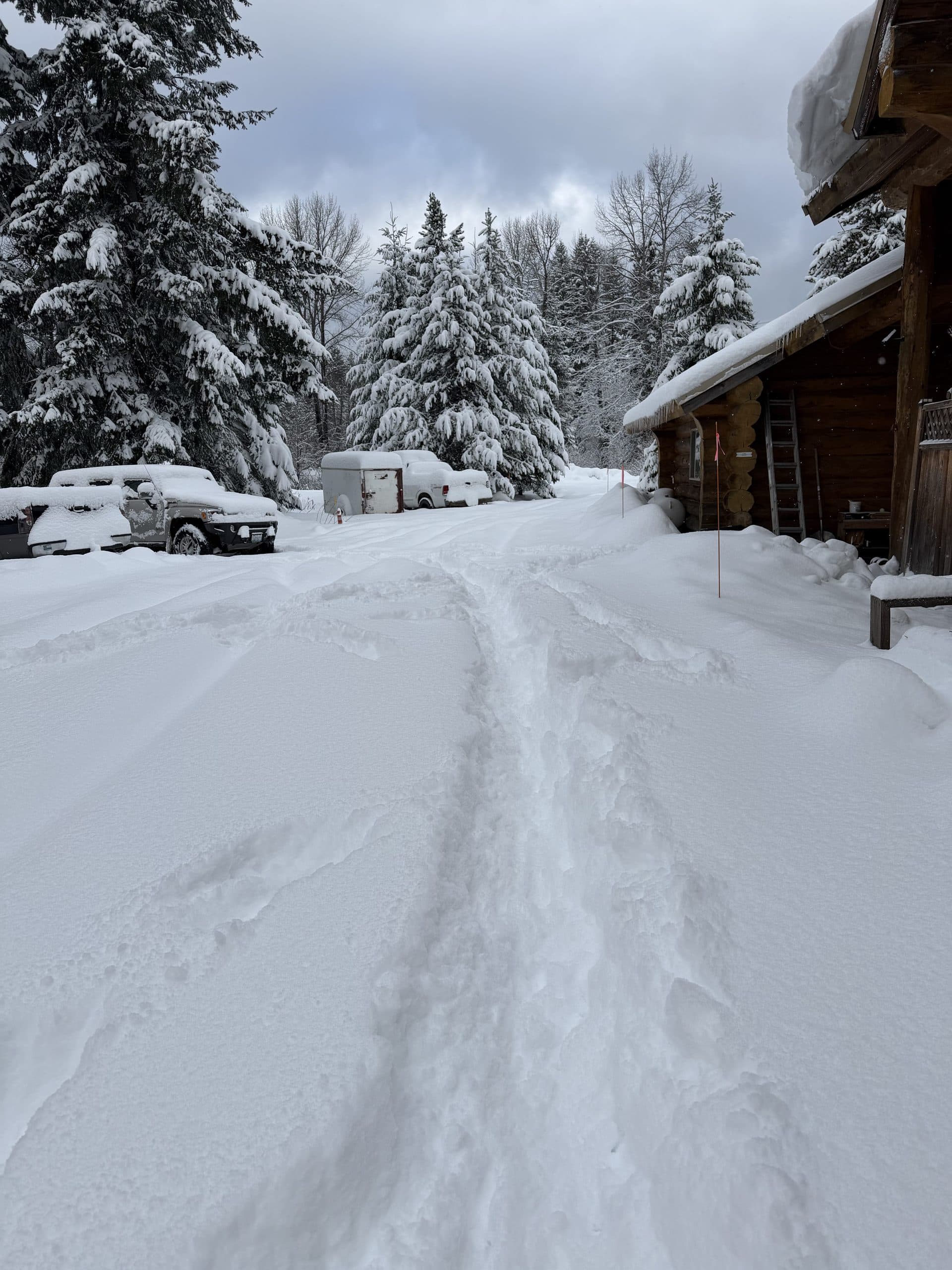 Lodge and property covered in deep winter snow