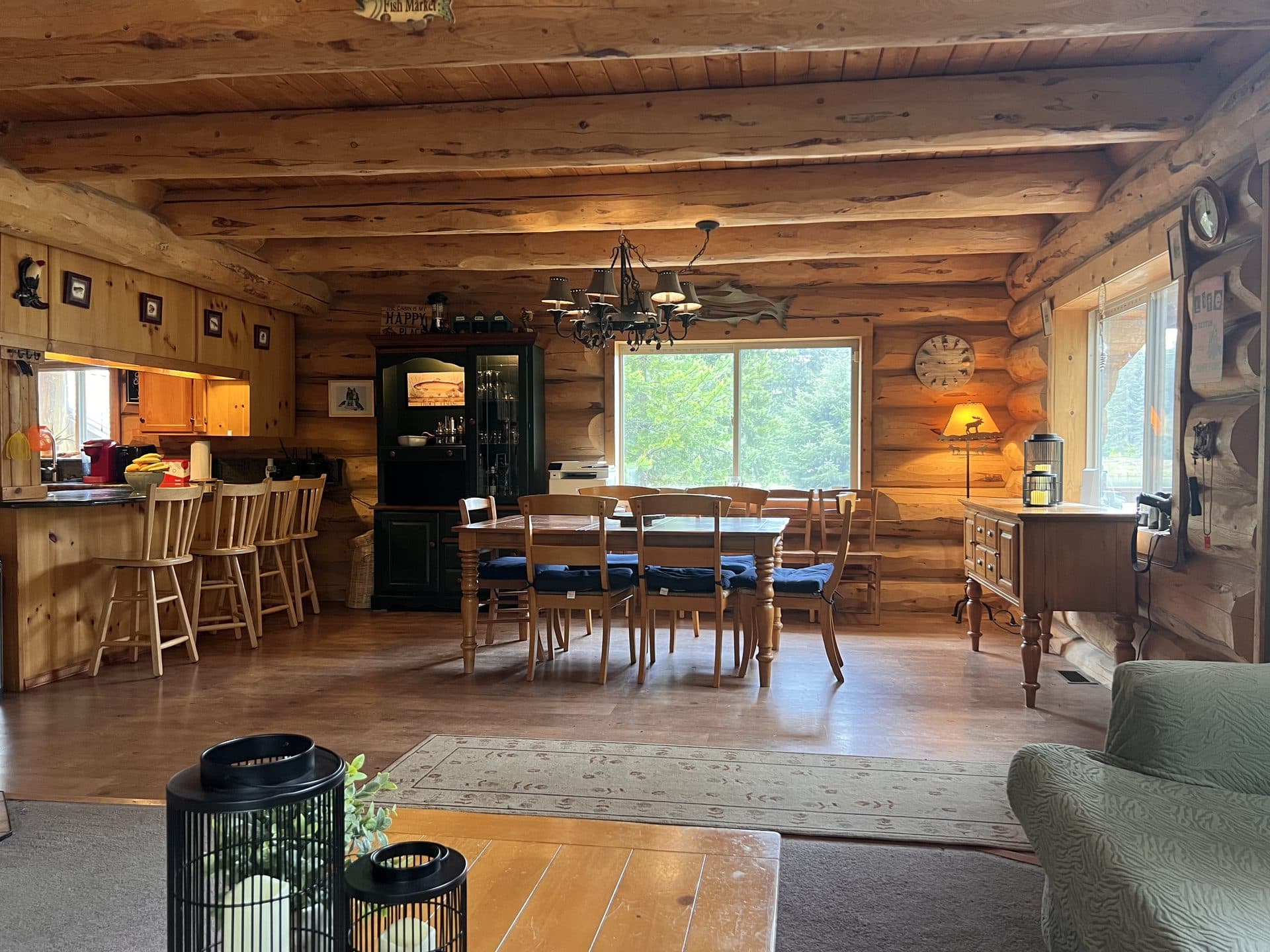 Lodge dining area with chandelier and open kitchen