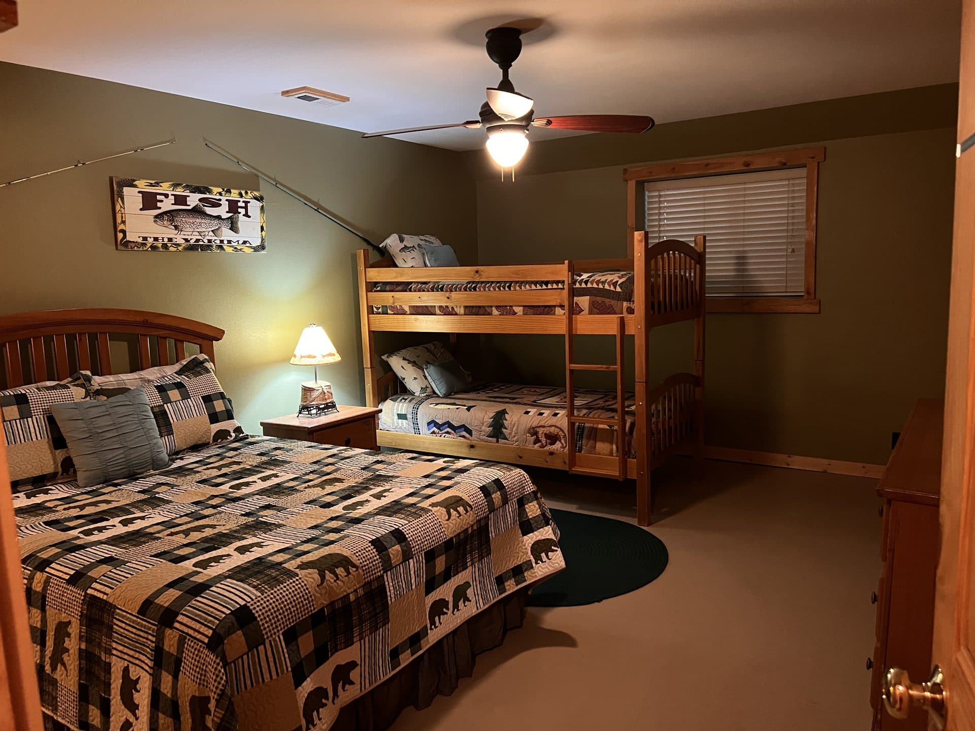 Lodge bedroom with queen bed and bunk beds