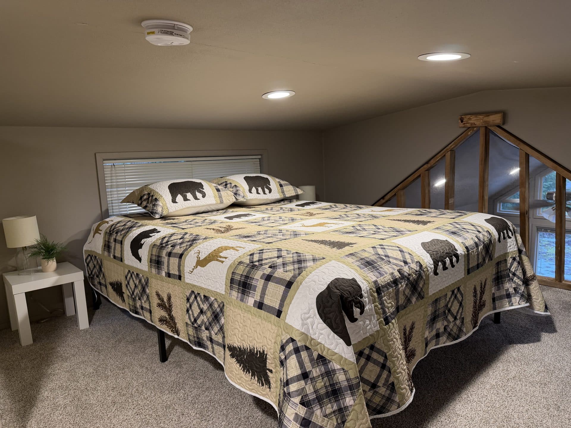 Tiny home loft bedroom with queen and full bed